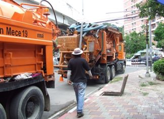 City workers move in heavy equipment to clean out the drains, hoping to prevent flooding during this year’s rainy season.